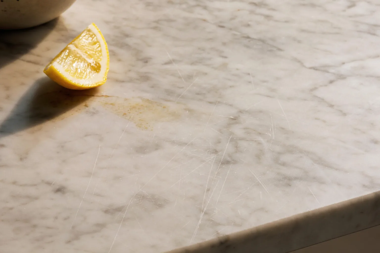 Kitchen with white oak cabinets and warm-toned quartzite countertops showing a harmonious natural material pairing